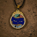 Medicine Buddha Eyes Circular Thangka Pendant · Object 2093